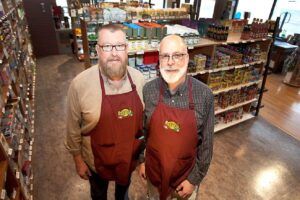 Todd Doleshall, left, and Glen Cook, co-owners of Farmer’s Pantry in Greeley. The grocer opened for business in November and features many locally grown Colorado products.