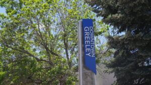 A sign advertises Downtown Greeley